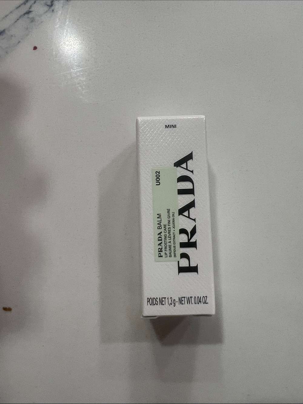 Prada Mini Lip Balm — White & Pale Green